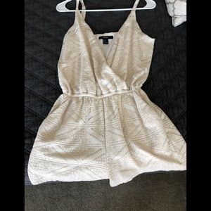 Jumper romper with pockets and button.